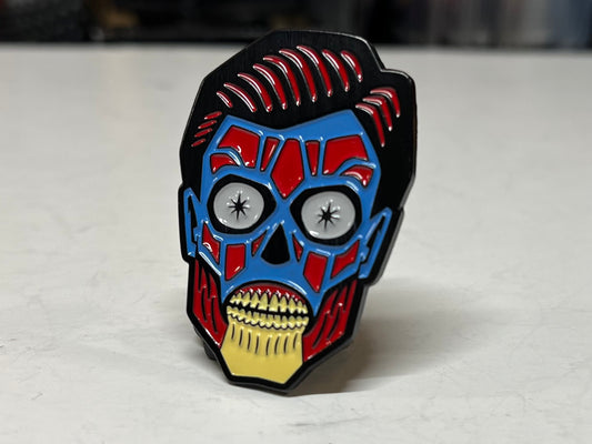 They Live alien head enamel pins back in stock