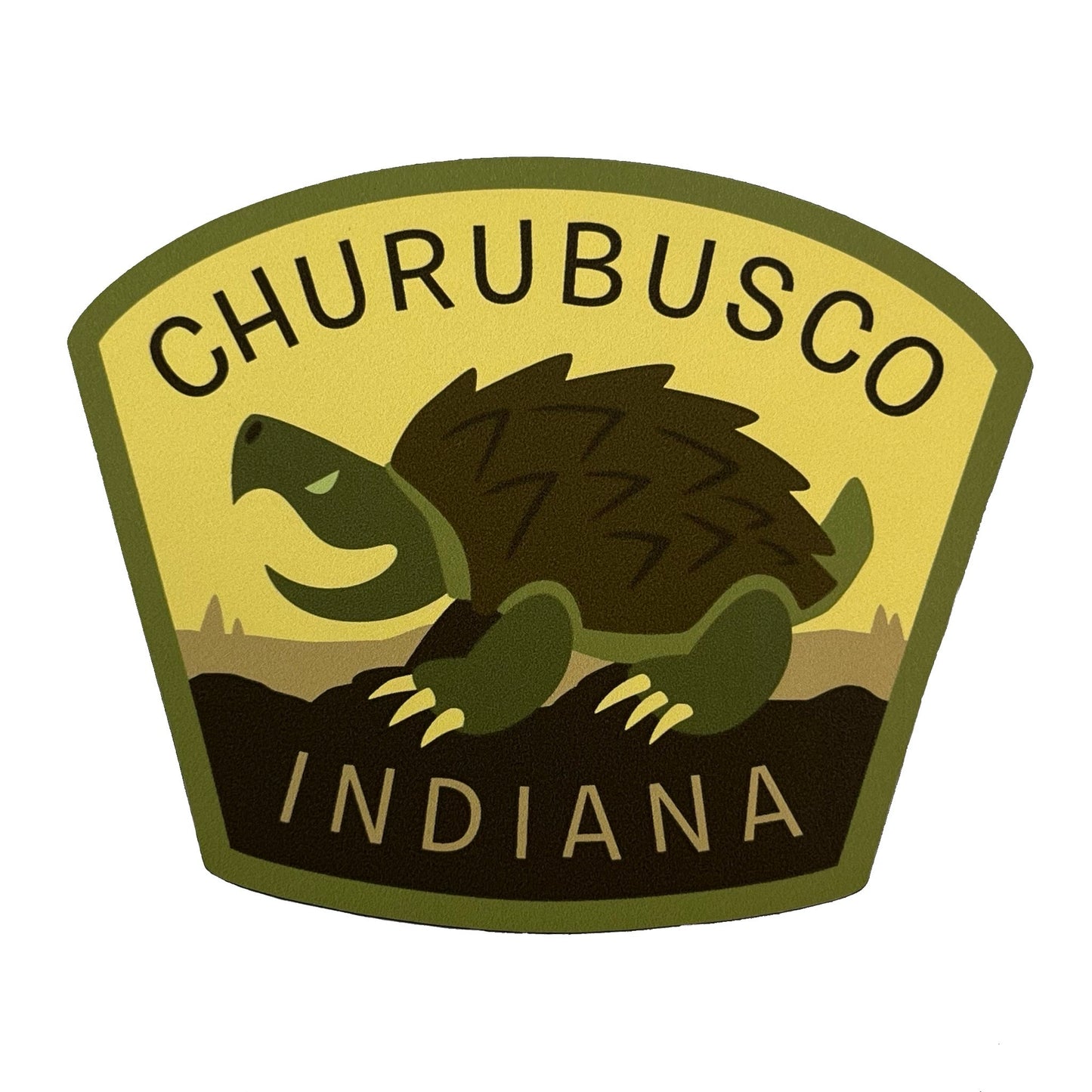 Logo of Churubusco, Indiana with a turtle illustration on a yellow background