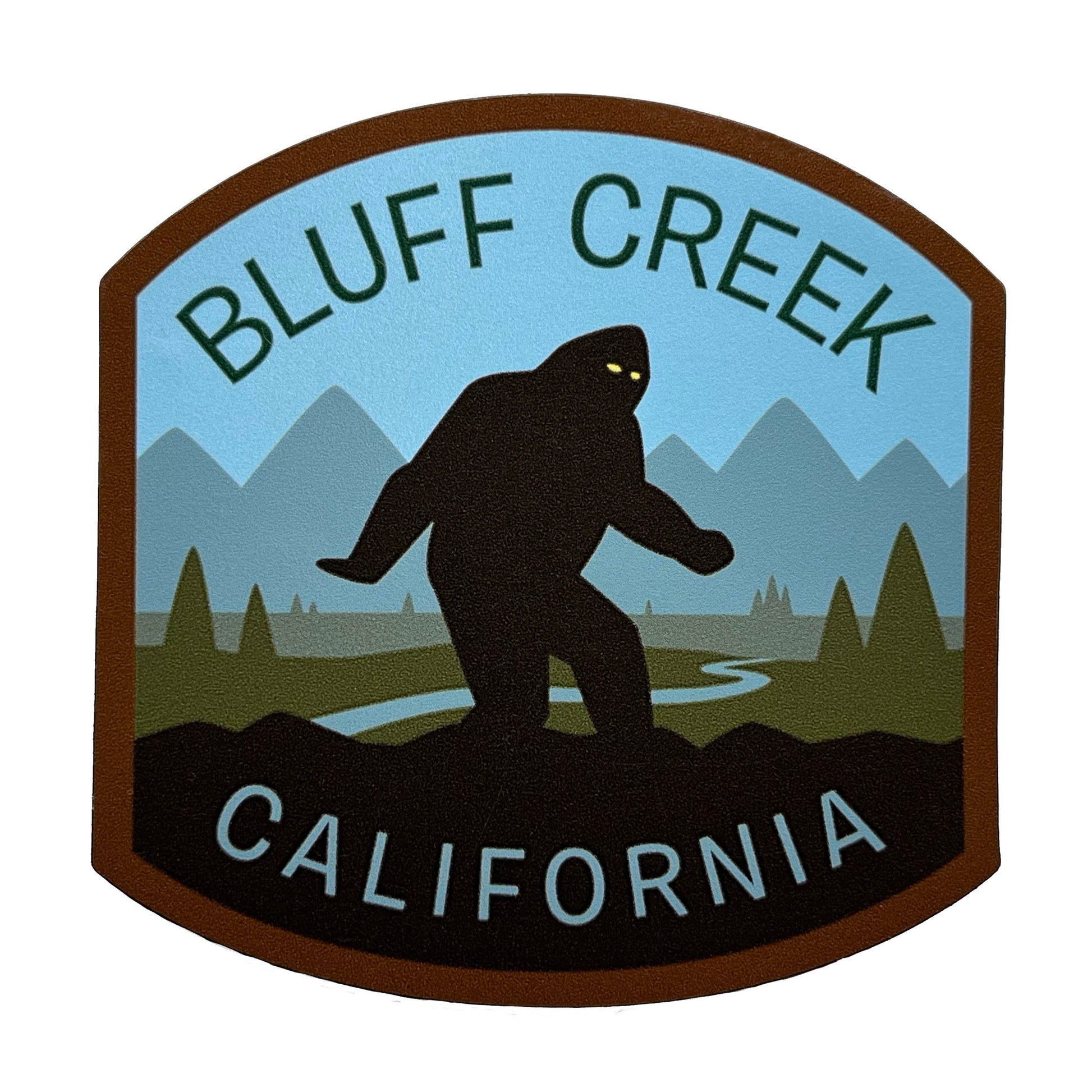Logo for Bluff Creek, California with a silhouette of a bigfoot and mountain background.