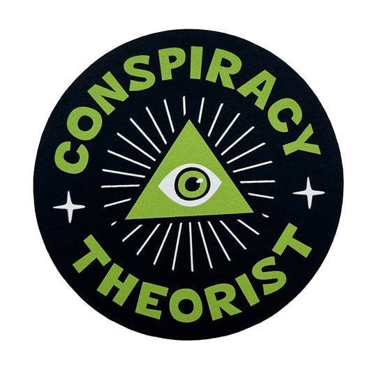 Circular sticker with green triangle and eye symbol, surrounded by 'Conspiracy Theorist' text on a black background.