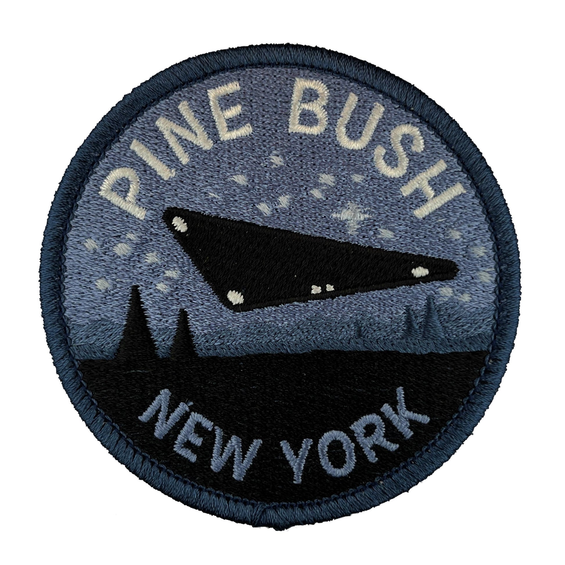 Patch with 'Pine Bush, New York' text and UFO design on a blue background