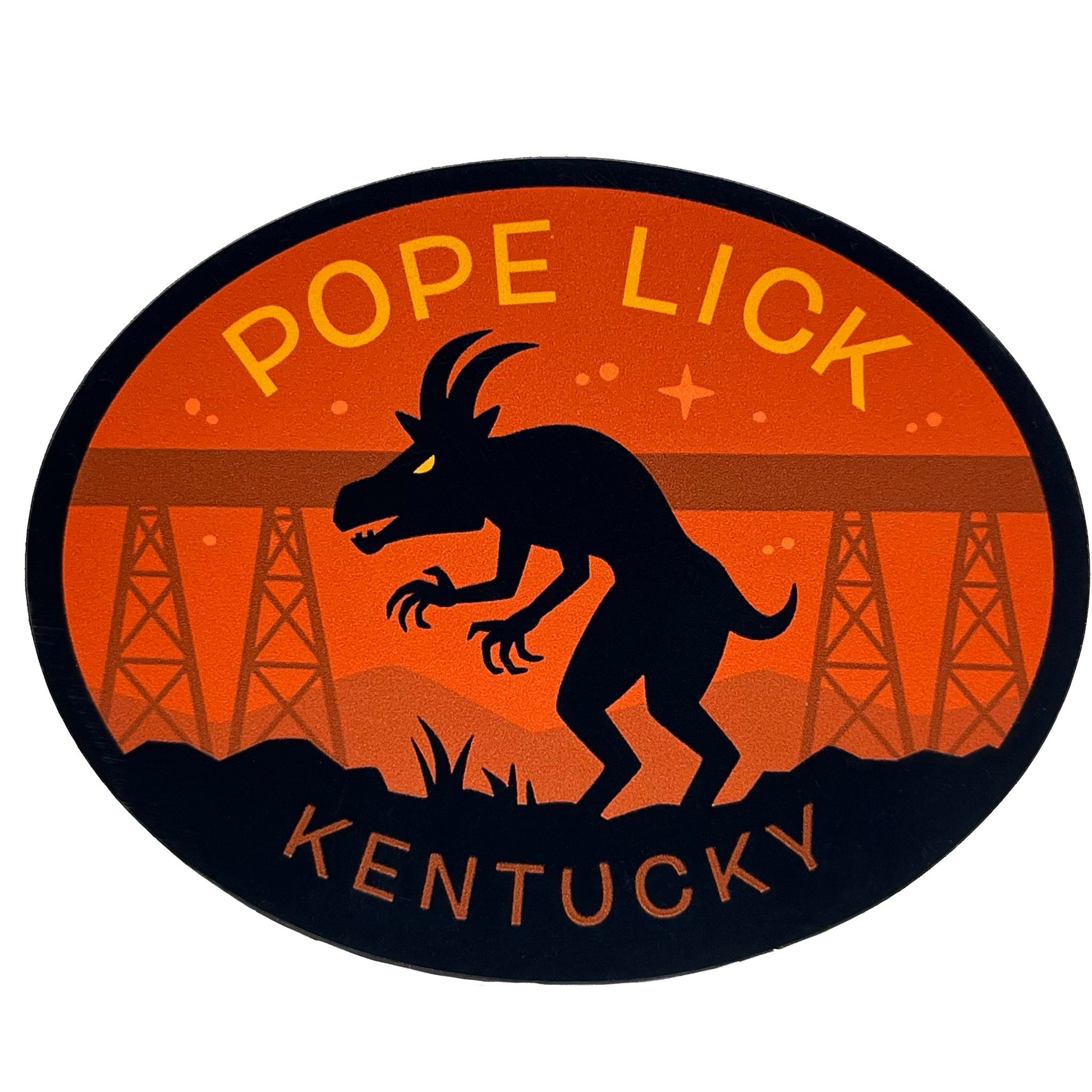 Oval-shaped magnet with silhouette of a Goat Man creature, 'Pope Lick Kentucky' text, and trestle bridge in background.