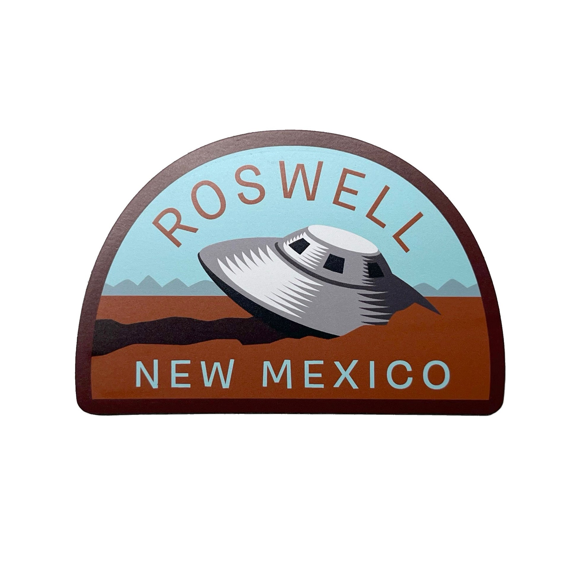 Roswell New Mexico design with a UFO crash in the desert design on a white background