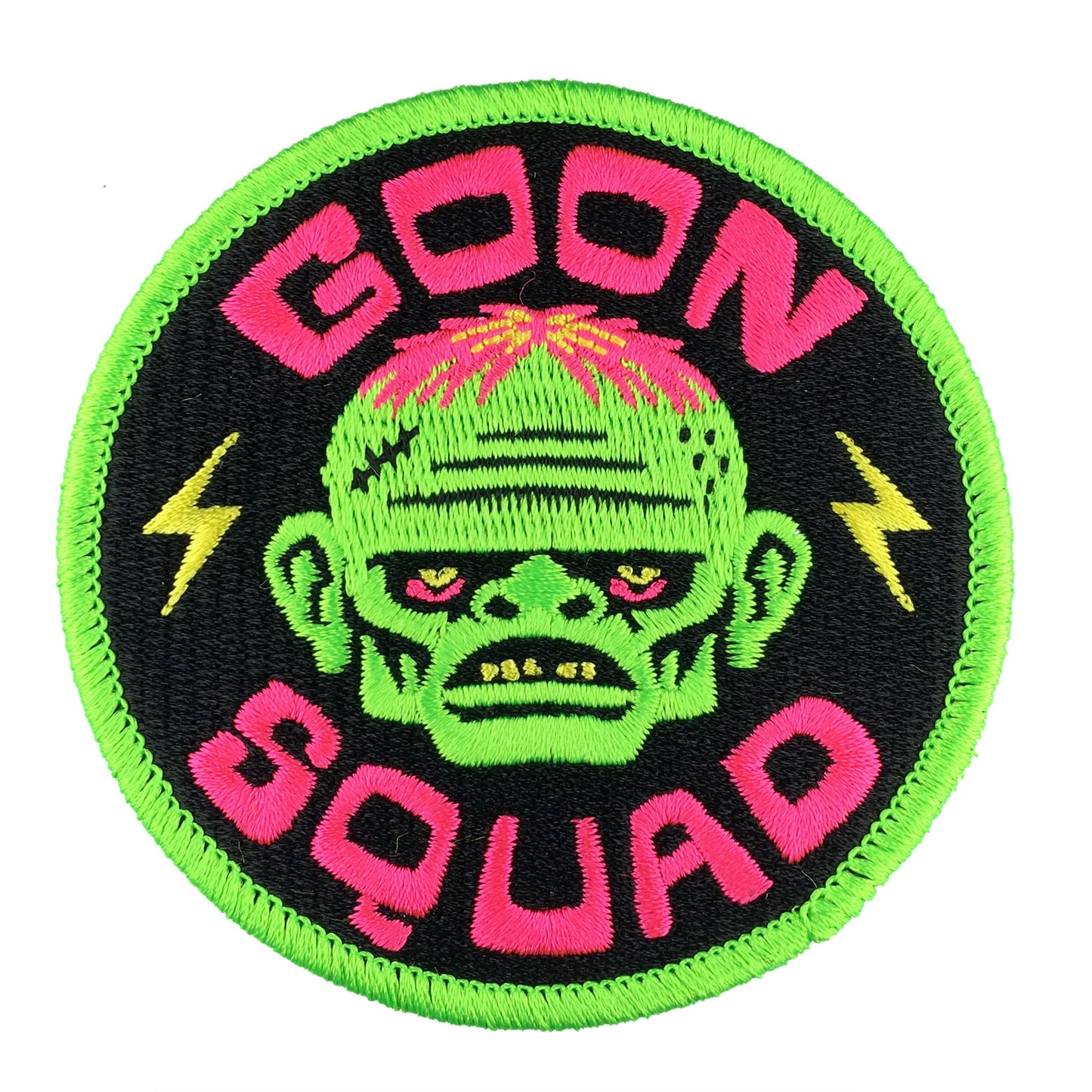 Circular patch with a green character and 'Goon Squad' text on a black background