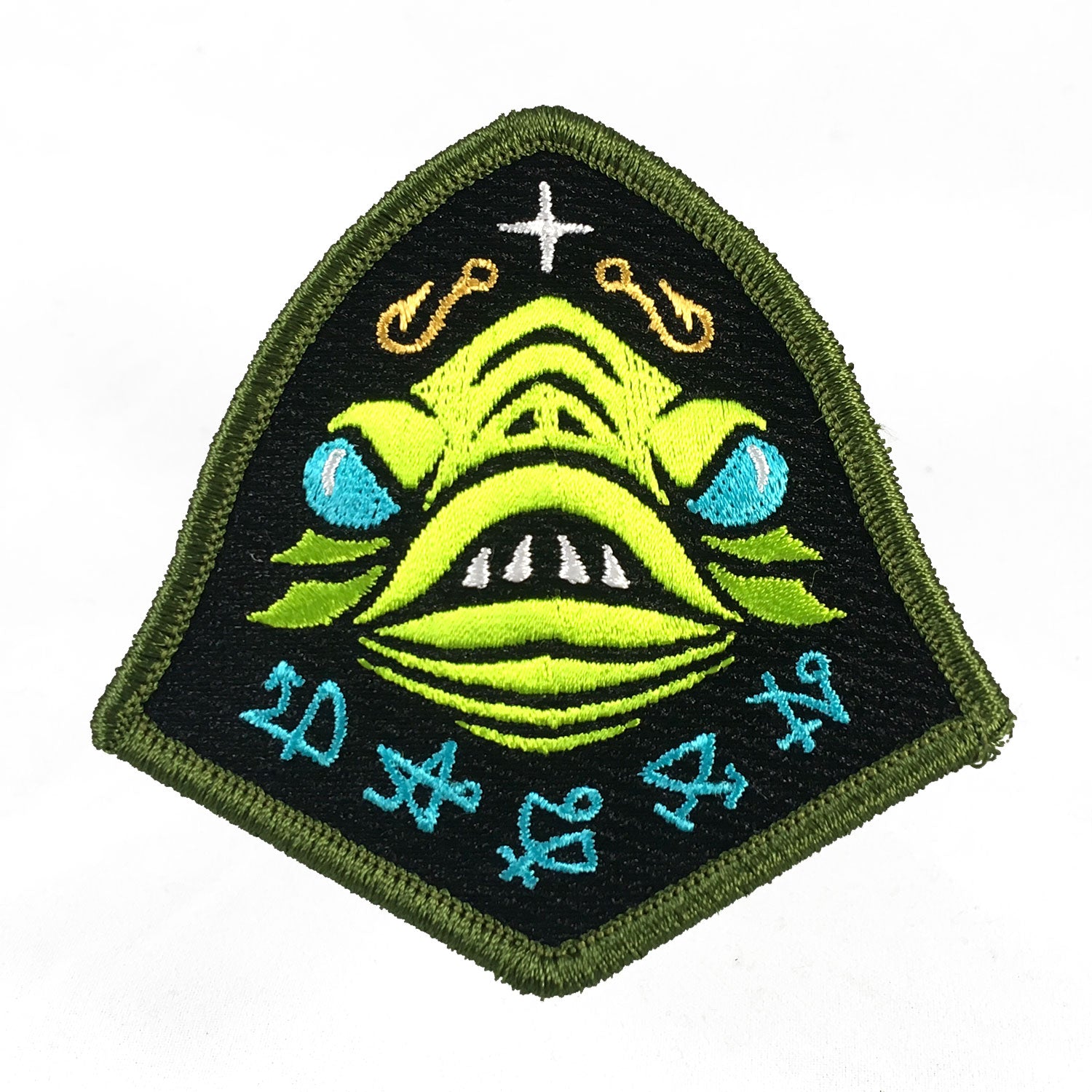 Embroidered patch with a green Lovecraft Dagon fish god face design on a black background